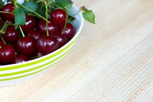 Lot of ripe cherries on a plate