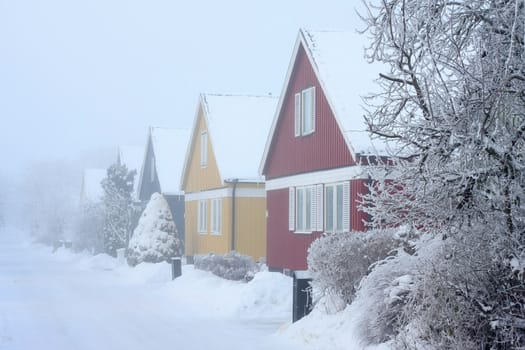 Houses in cold,chilly and frosty winter climate.