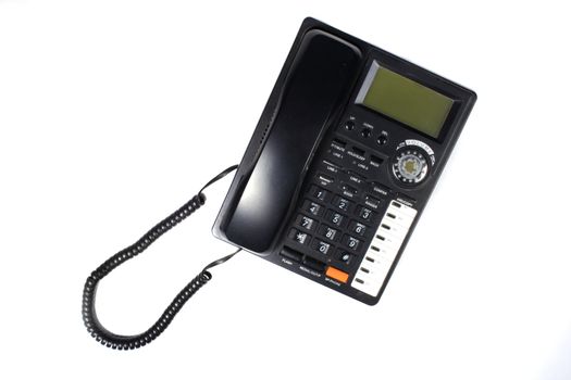 A black telephone with memory book and caller ID feature, isolated on white studio background.