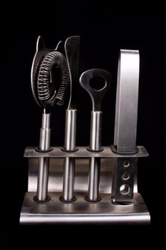A toolset for barternder consisting of an opener, cork opener and other tools.