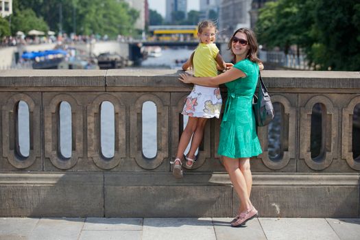 Tourists. Beautiful mother and daughter walking in berlin city.