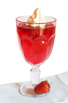 Strawberry jelly with fresh strawberry and cream in tall glass on white background