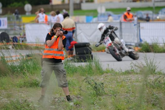 TAXENBACH, AUSTRIA - JUN 5: Supermoto trophy race. Photographer at the final race on June 5, 2011 in Taxenbach, Austria.