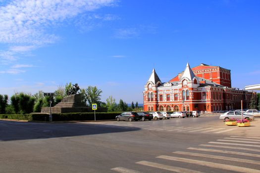 Town landscape with historic theatre and blue sky