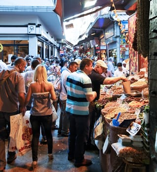 June 2011 Crowded Market street scene Grand Bazaar Istanbul, Turkey, pedestrians and locals shopping at market stalls