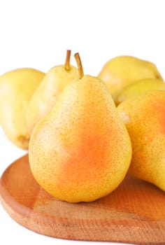 Bunch of ripe yellow pears on white background