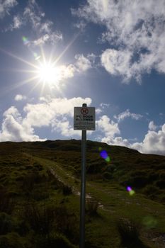 a no dogs allowed sign on a sheep farmers land