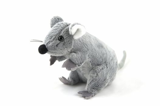 The grey toy mouse on a white background