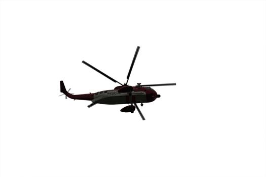 a helicopter on a life air sea rescue mission on a white background