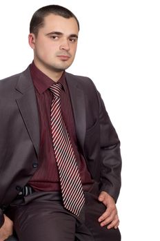 young businessman in shimmering suit and red shirt