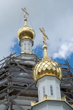 cupolas of orthodox temple with sky at background