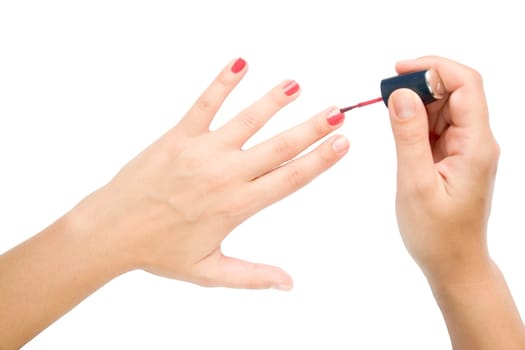 Closeup. Female hands make manicure.