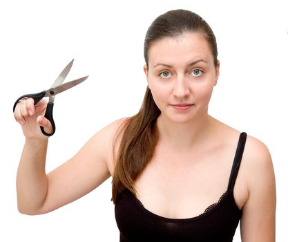 The young woman with scissors on a white background