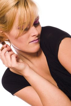 Studio portrait of a red haired model playing with her hair