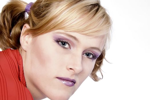 Studio portrait of a red haired model looking pensive but alert