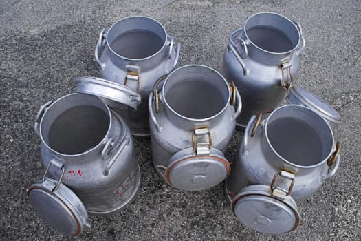 five opened milk cans 