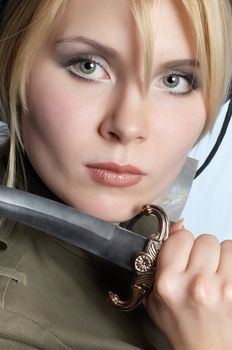 scout blond girl wearing uniform, with knife