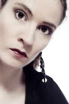 Studio portrait of a young woman looking serious