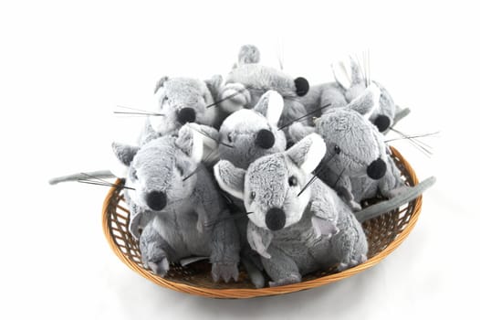 Colony of grey toy mice sitting in a basket