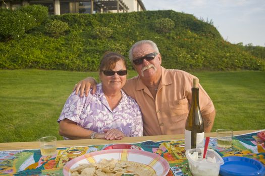 Senior Couple enjoys an outdoor Picnic 