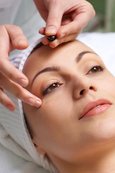 applying of vitamin treatment for facial skin in the beauty salon