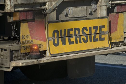sign of the back of an oversize truck