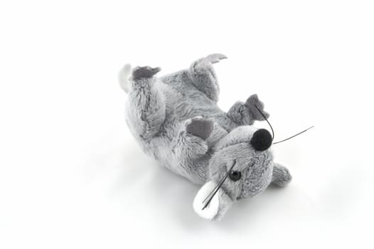 The grey toy mouse on a white background