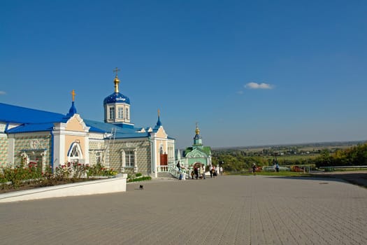 Temples of a monastery on a background of the blue sky                               