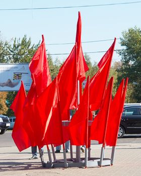 Communistic red flags flutter on a wind
