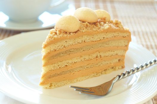 Caramel medovik cake made of honey and caramel cream with coffee