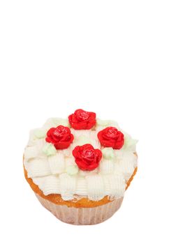 Fresh vanilla cupcake with basketweave buttercream icing and roses on white background