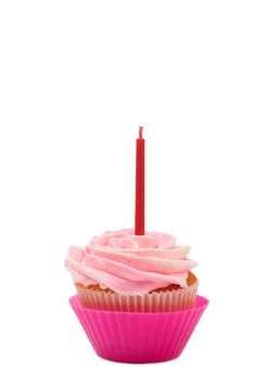 Fresh vanilla cupcake with rose buttercream icing and birthday candle on white background