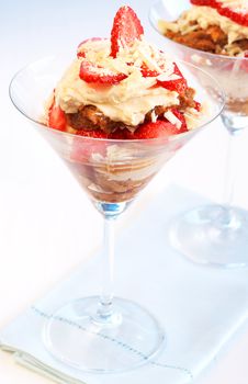 Italian dessert strawberry and mascarpone tiramisu in tall glasses