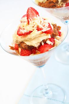 Italian dessert strawberry and mascarpone tiramisu in tall glasses