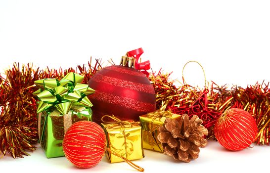 Red Christmas baubles and other decorations on white background with copy space. 