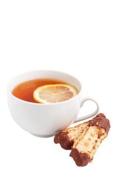 Cup of tea with lemon and chocolate dipped cookies on white background