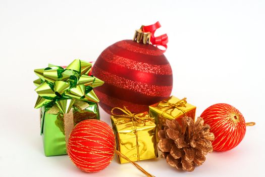 Red Christmas baubles and other decorations isolated on white background with copy space. 