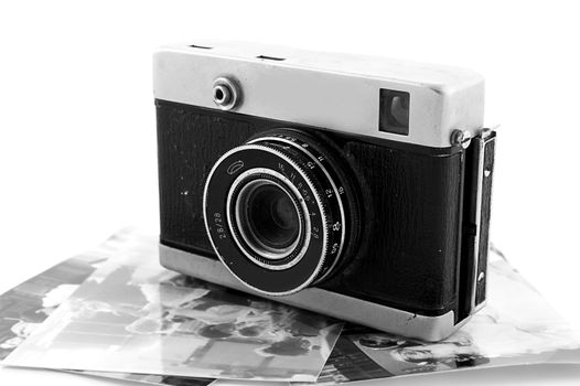 Vintage film camera and some photos over white