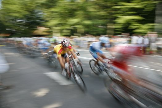 The cyclists riding by at the bicycle race Around Denmark