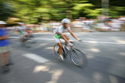 The cyclists riding by at the bicycle race Around Denmark