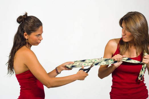 Two women  pulling a tie with dollar notes