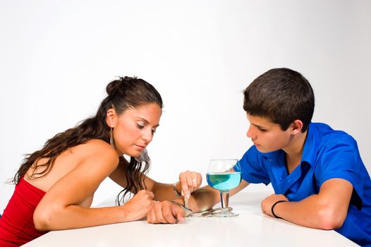 Woman unchaining a teenager from his alcohol addiction
