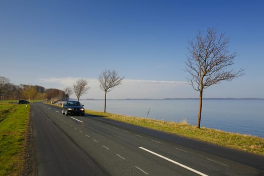 Driving along a coastal highway - Denmark - at springtime.