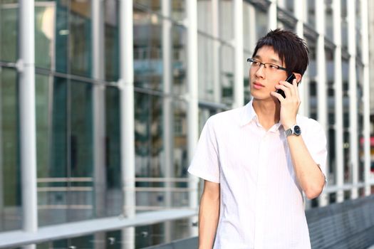 businessman talks with a mobile phone 