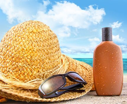 Beach items and suntan lotion on table at the beach