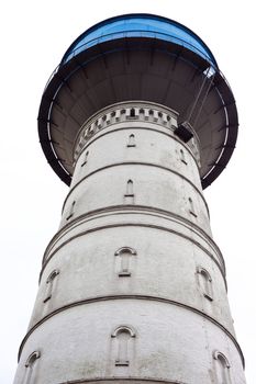 Historic water reservoir brick tower landmark still in use (isolated on white).