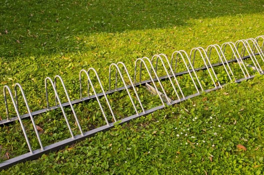 Healthy travel. Parking for bicycles on green grass.