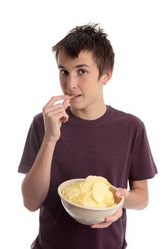 A boy eating crinkle cut potato crisps snack food.