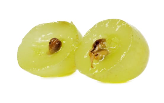 Translucent slice of green grape fruit, macro isolated on white 
