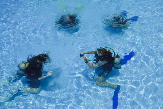 Divers training in a swimming pool. Ko phi phi island.